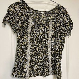 Cute short sleeve shirt with brown and yellow print with lace accent by Cato.